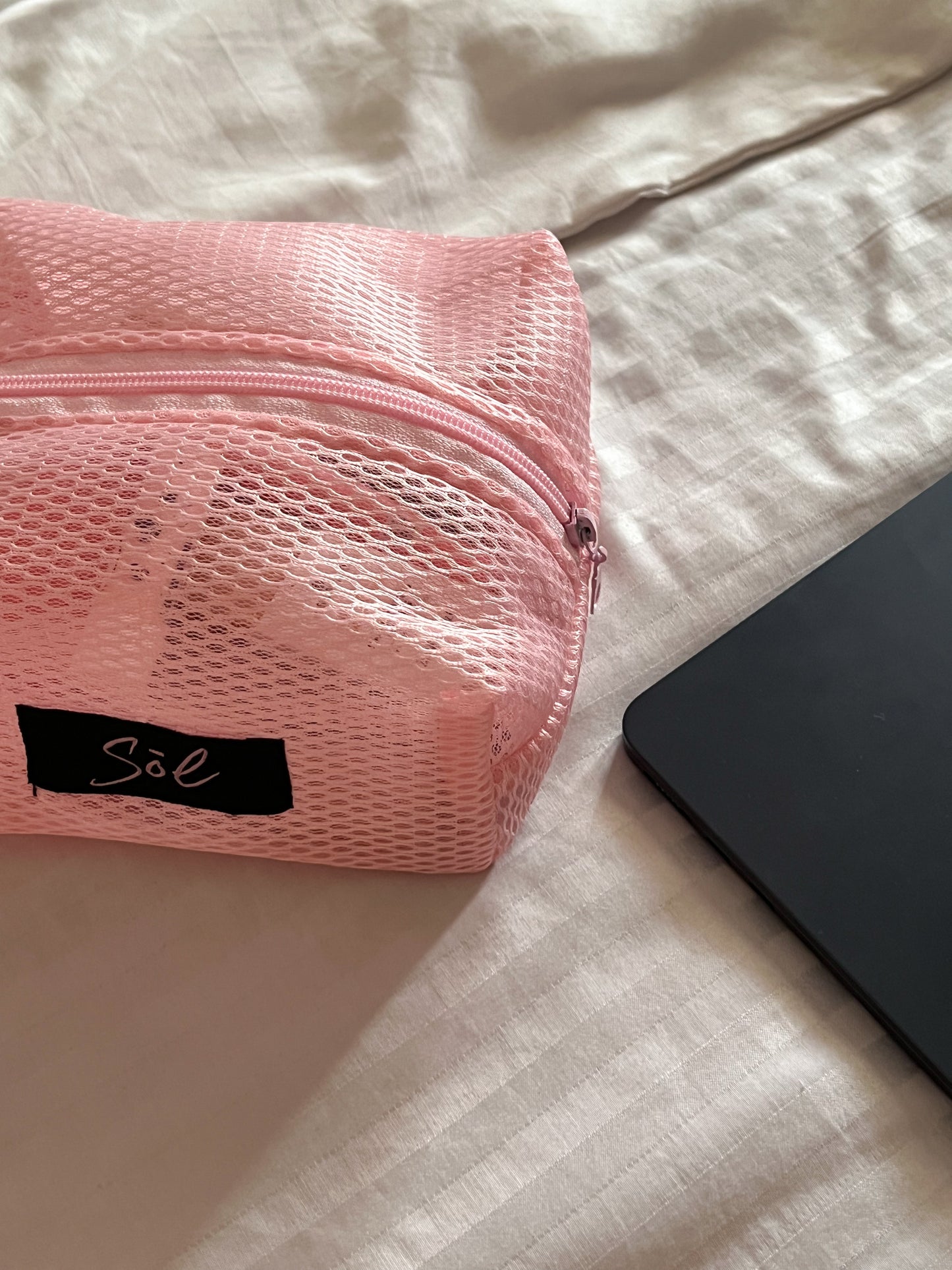 Pink mesh pouch
